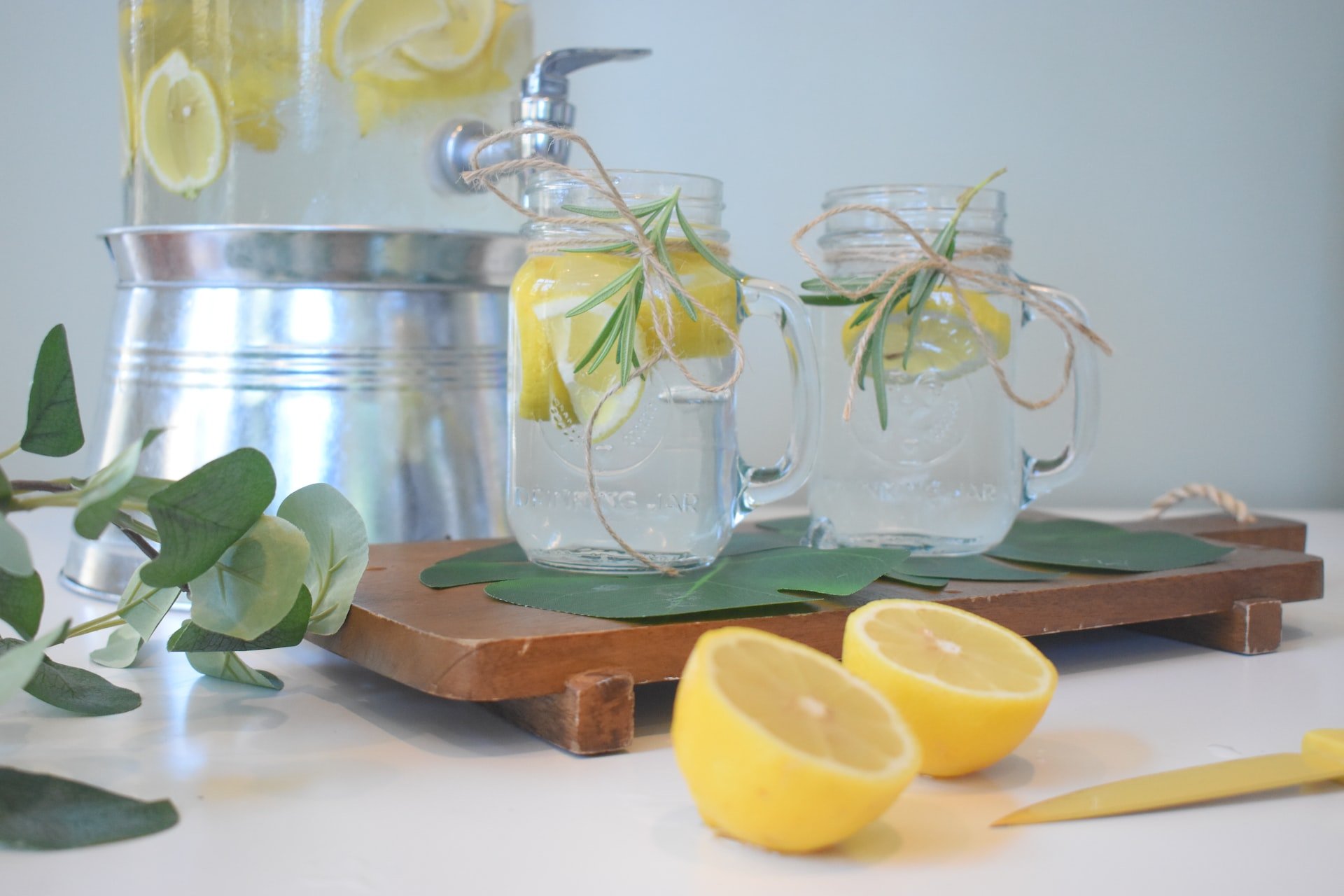 A water dispenser with lemons.